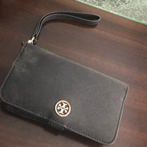 Tory Burch wallet case that hold standard IPhone.